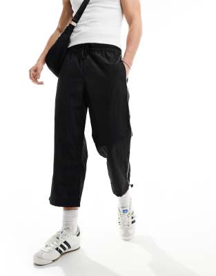 Asos Design Wide Awkward Length Nylon Pants With Toggle Detail In Black