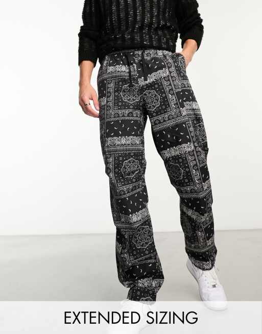 ASOS DESIGN wide cargo parachute pants in black paisley print