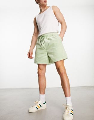 ASOS DESIGN wide cord shorts in shorter length in light green