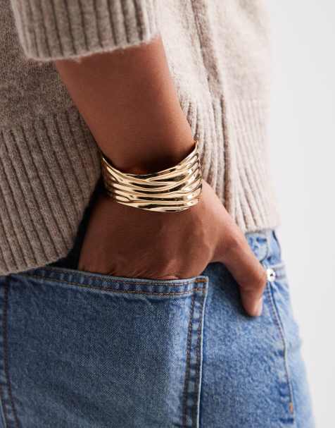 ASOS DESIGN wide cuff bangle with ridged texture in gold tone - view 1