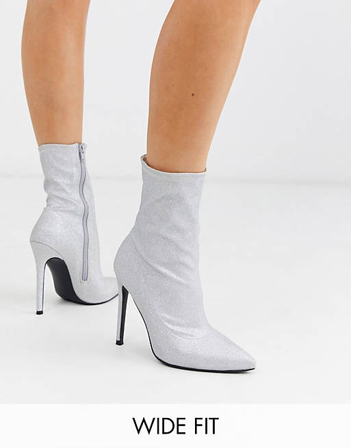 ASOS DESIGN Wide Fit Esmerelda high heeled sock boots in silver glitter ...