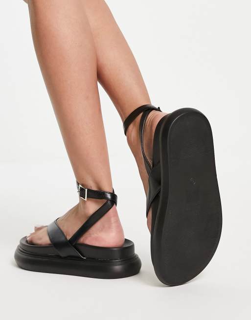 Truffle Collection Wide Fit flatform toe thong sandals in black, ASOS