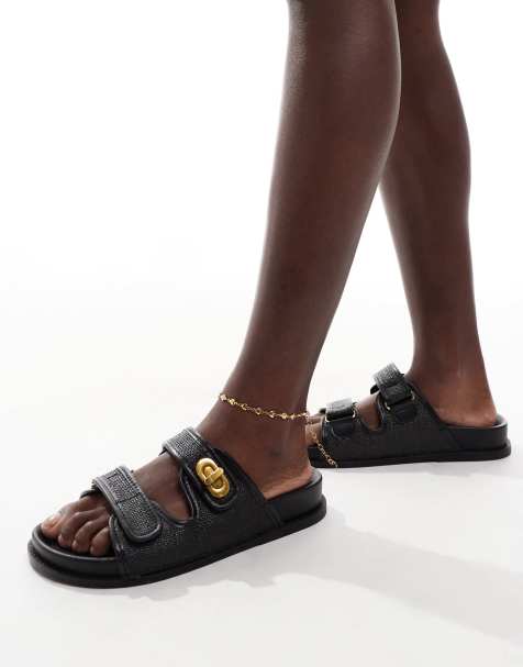 ASOS DESIGN Wide Fit Fawn footbed sliders with twist lock in black - view 1