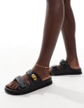 [ASOS DESIGN Wide Fit] ASOS DESIGN Wide Fit Fawn footbed sliders with twist lock in black 7 Black weave