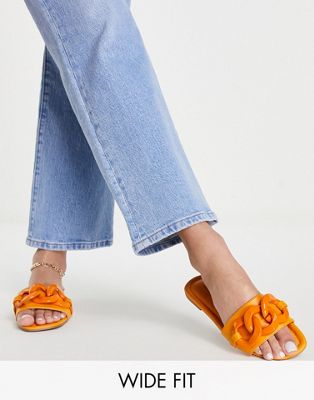 ASOS DESIGN Wide Fit Fife flat mules with chain in orange