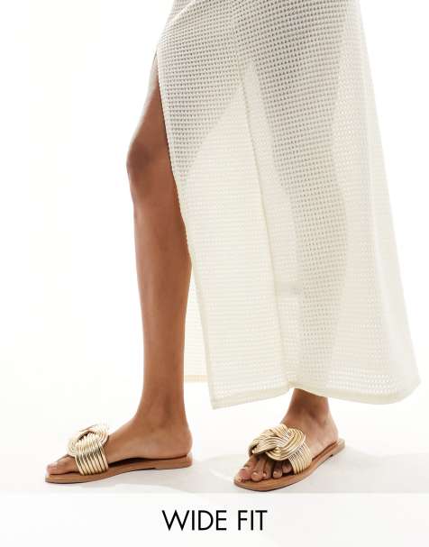 ASOS DESIGN Wide Fit Fifi woven mule flat sandals in gold - view 1