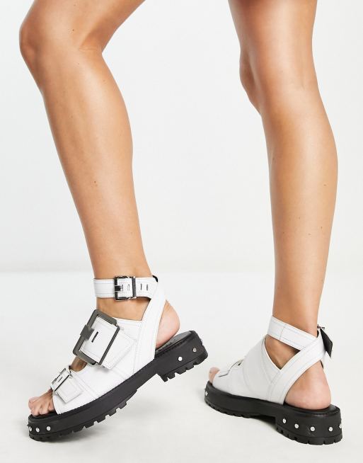 White chunky flat store sandals