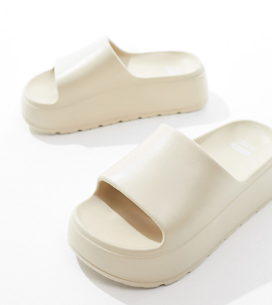 Asos Design Wide Fit Freedom Cleated Chunky Sliders In Off-white In Neutral