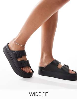 ASOS DESIGN Wide Fit - Freestyle - Sandalen in Schwarz mit flacher Plateausohle und zwei Schnallen, weite Passform