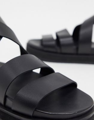 black sole sandals