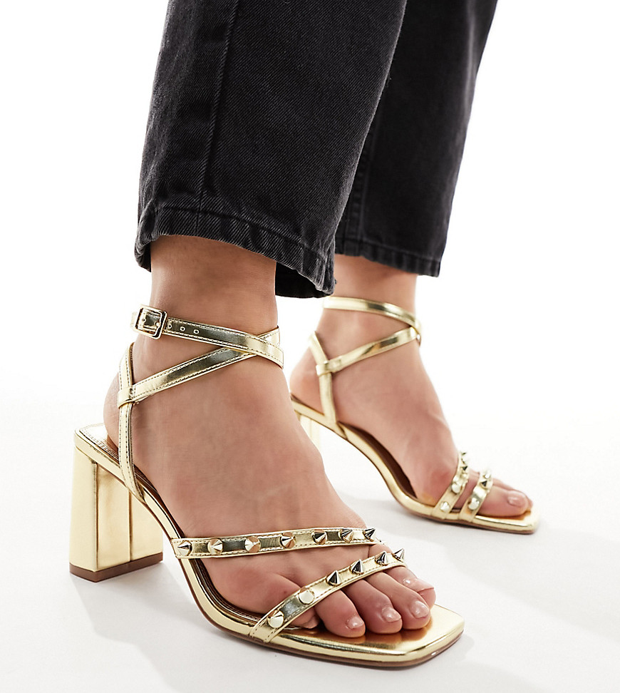 ASOS DESIGN Wide Fit Hampstead studded mid heeled sandals in gold