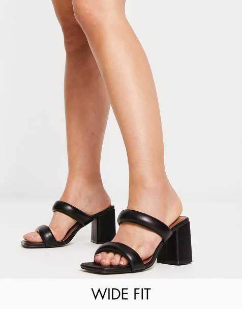 ASOS DESIGN Wide Fit Height padded mid heeled mules in black - view 1