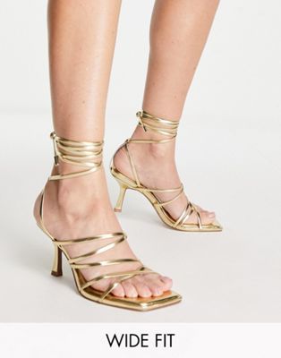 Asos Design Wide Fit Hiccup Strappy Tie Leg Mid Heeled Sandals In Gold