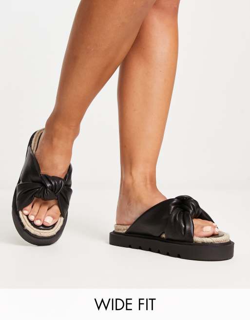 ASOS DESIGN Wide Fit Fixation cross strap jelly flat sandals in black