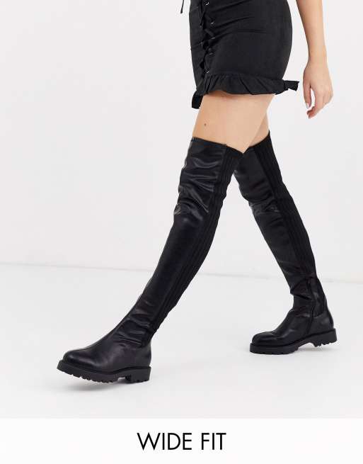 Wide fit thigh store high flat boots