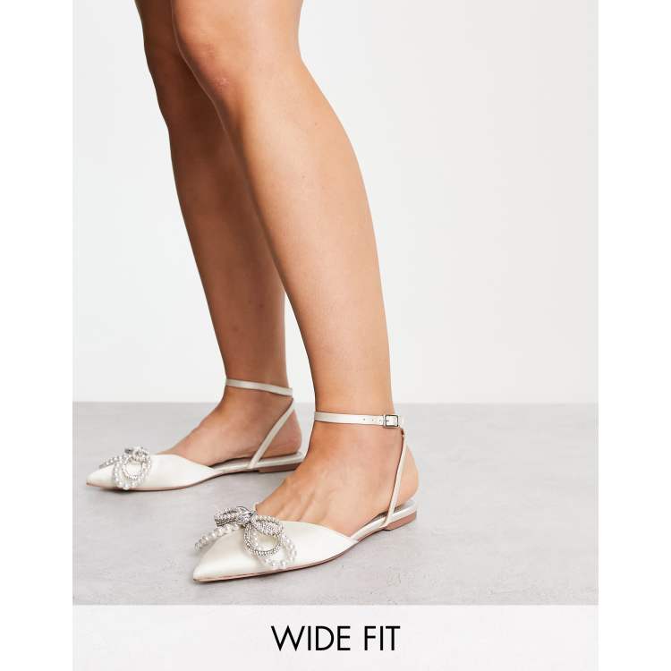 Ivory flats store with ankle strap