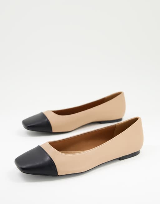 Beige and black store flats