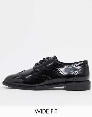 black flat tie up shoes