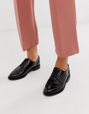 black flat tie up shoes