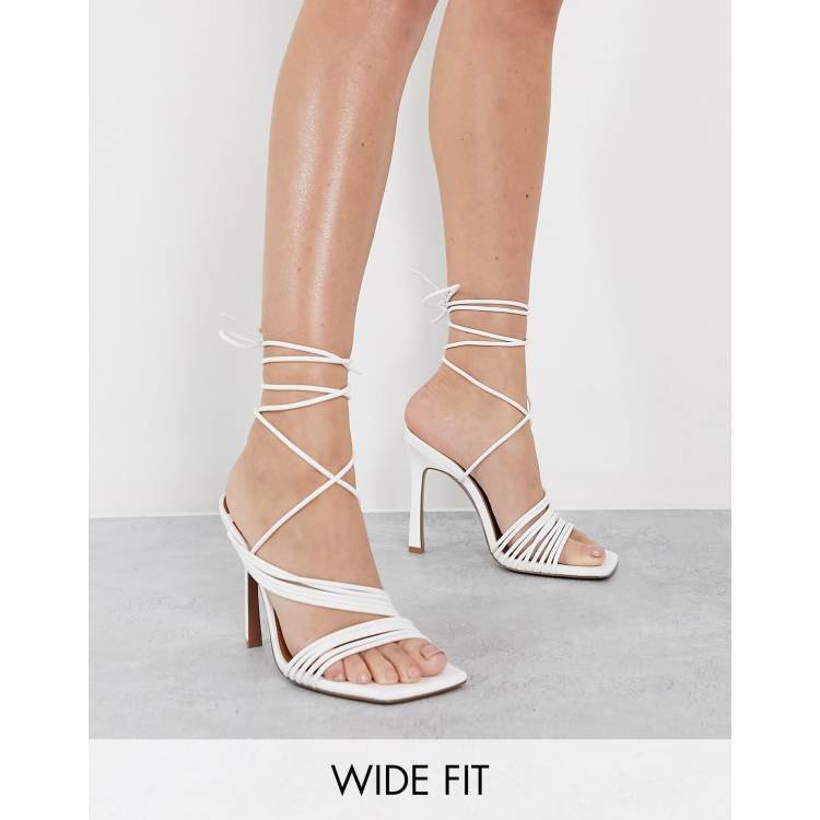 ASOS DESIGN Wide Fit Nest strappy tie leg heeled sandals in white