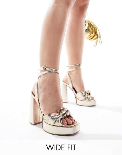 ASOS DESIGN Wide Fit Nikita knotted platform block heeled sandals in gold - view 1