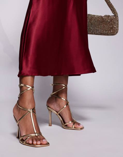 ASOS DESIGN Wide Fit Nobel caged high heeled sandals in gold - view 1