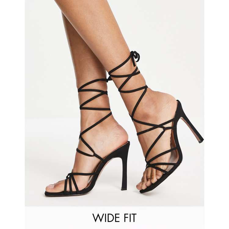 High heels with cheap straps up the leg