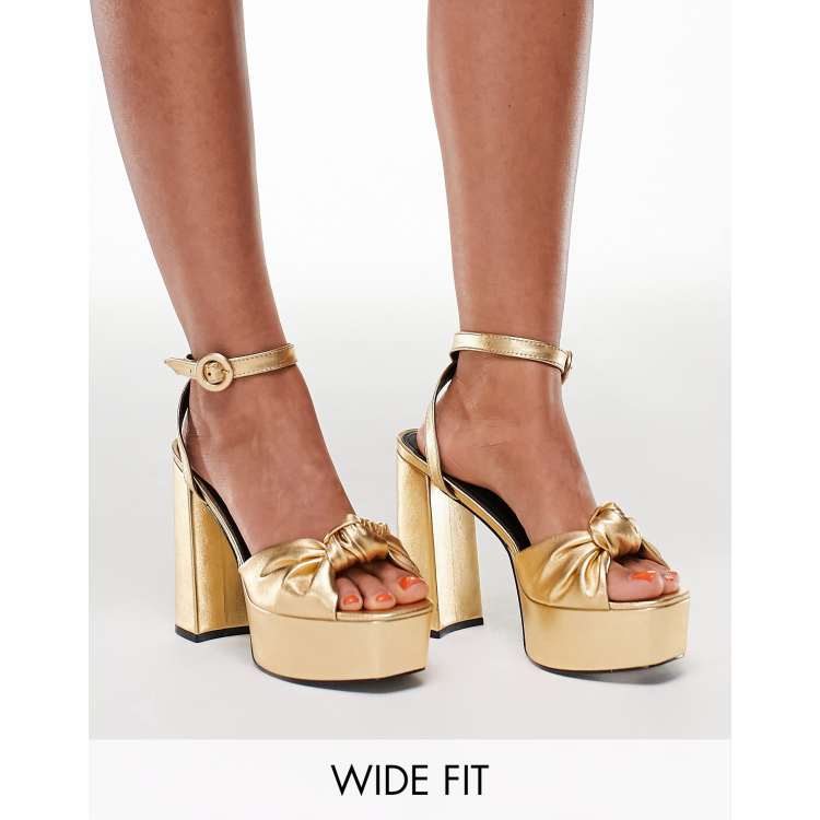 ASOS DESIGN Wide Fit Note knotted platform heeled sandals in gold