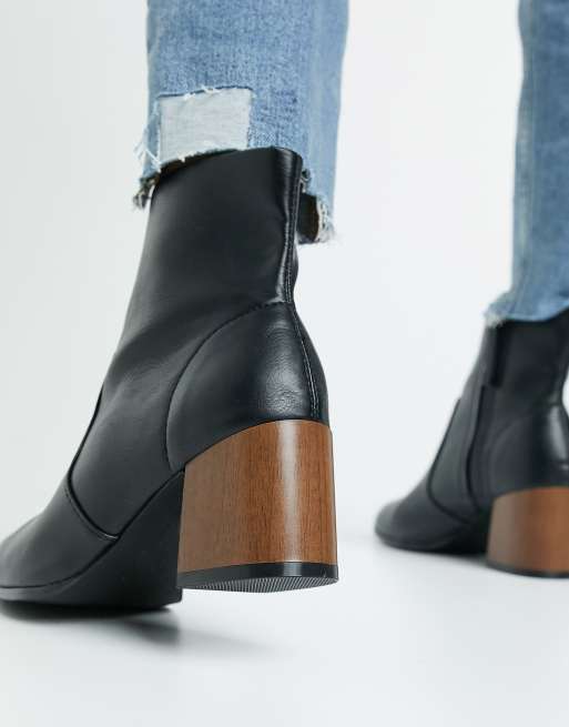 ASOS DESIGN Wide Fit Reporter heeled boots with flared wooden heel in black