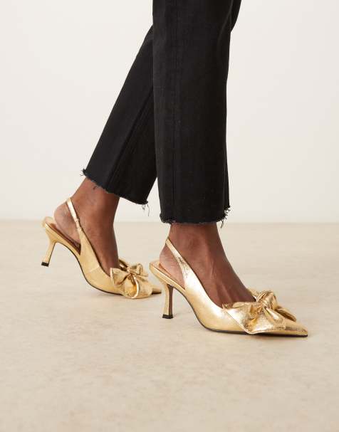 ASOS DESIGN Wide Fit Saffron bow detail mid heeled shoes in gold - view 1