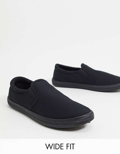 ASOS DESIGN Wide Fit slip on plimsolls in black canvas | ASOS