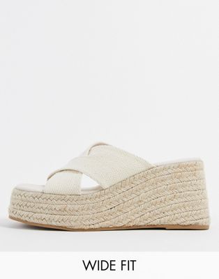 ASOS DESIGN Wide Fit Teddy cross strap wedge in natural fabrication