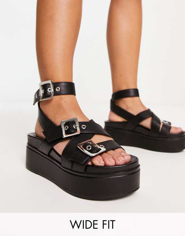 ASOS DESIGN Wide Fit Trumpet chunky buckle detail flatforms in black