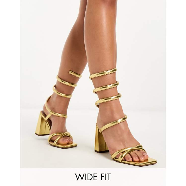 ASOS DESIGN Wide Fit Wrap ankle coil high heeled sandals in gold