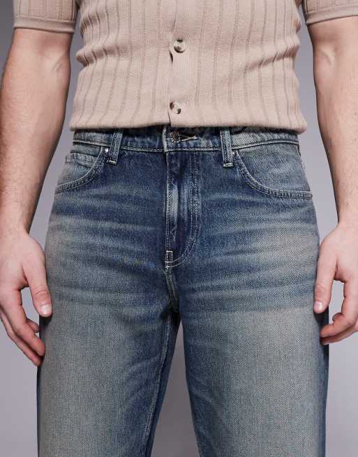 ASOS DESIGN wide flare jeans with tint in mid wash blue