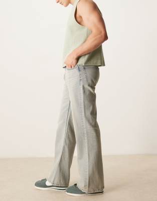 Asos Design Wide Flare Jeans With Vintage Tint In Blue