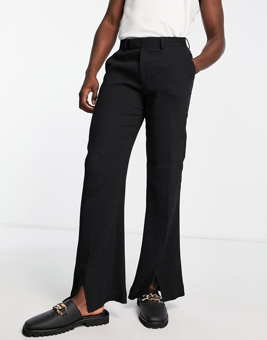 ASOS DESIGN wide flare pants with a front split in black plisse
