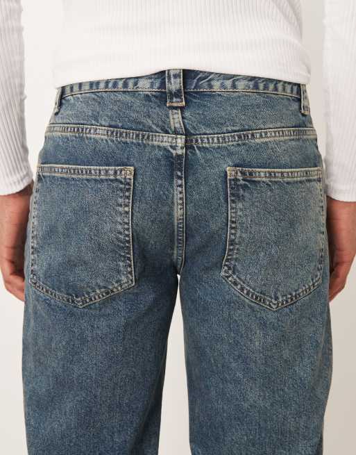 ASOS DESIGN wide flared jeans in mid wash blue with yellow tint - part of a set