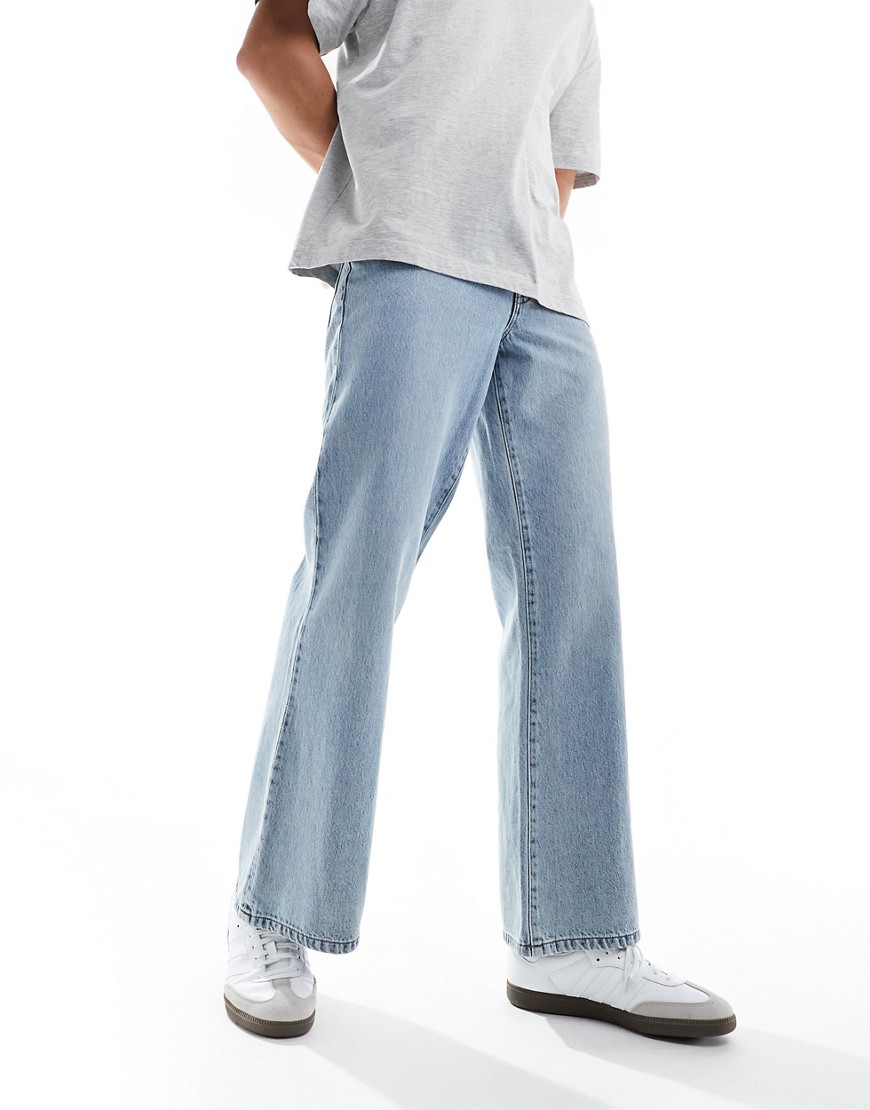 ASOS DESIGN wide flared jeans in mid wash blue