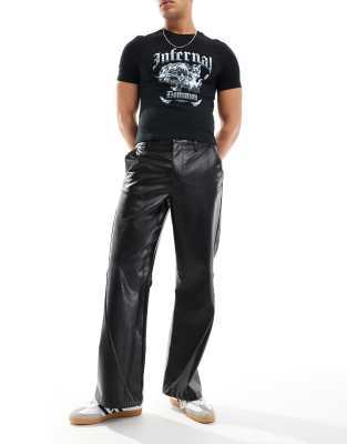 wide hem baggy leather look pants in black with sporty piping