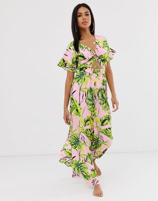ASOS DESIGN wide leg beach jumpsuit with cut out waist & ring detail in pink palm print