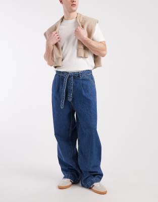ASOS DESIGN wide leg jeans in mid wash blue with pleats and belt-Navy