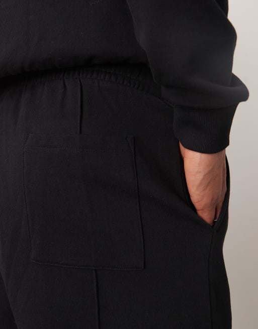 ASOS DESIGN wide leg jogger with pin tucks and zip fastening in black, 5 of 5