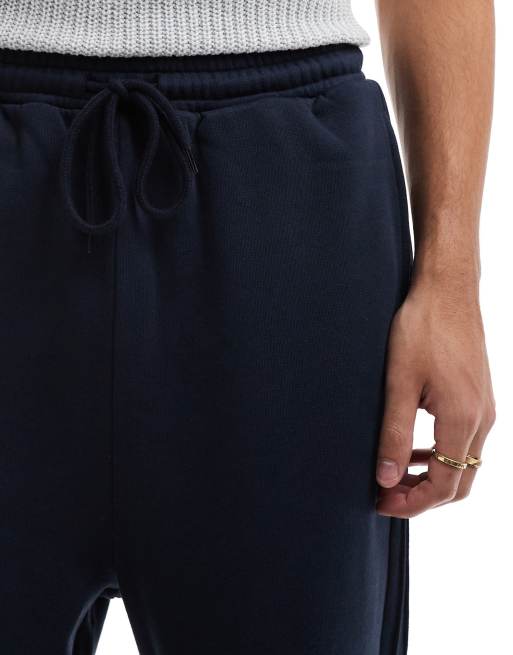 ASOS DESIGN wide leg joggers with pin tuck detail in navy ASOS