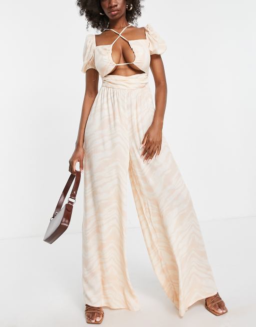 ASOS DESIGN wide leg jumpsuit with halter straps and puff sleeve in
