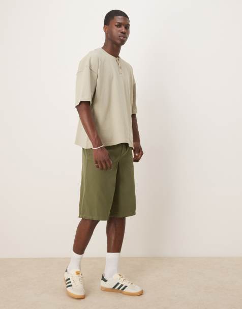 ASOS DESIGN wide leg longline herringbone shorts in green - view 1
