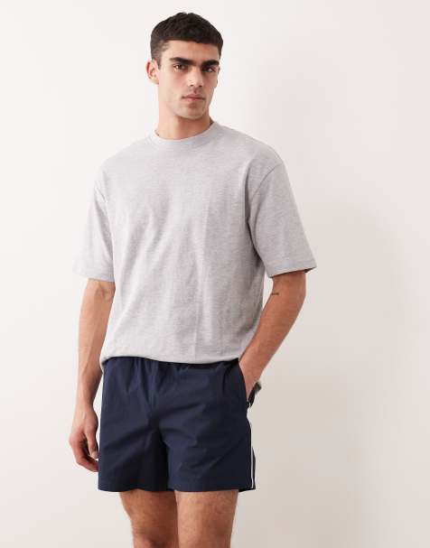 ASOS DESIGN wide leg mid length elasticized nylon shorts with piping in navy - view 1