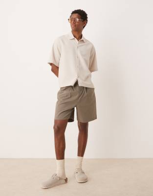 ASOS DESIGN wide leg mid length pleated shorts with drawstring in khaki - view 1