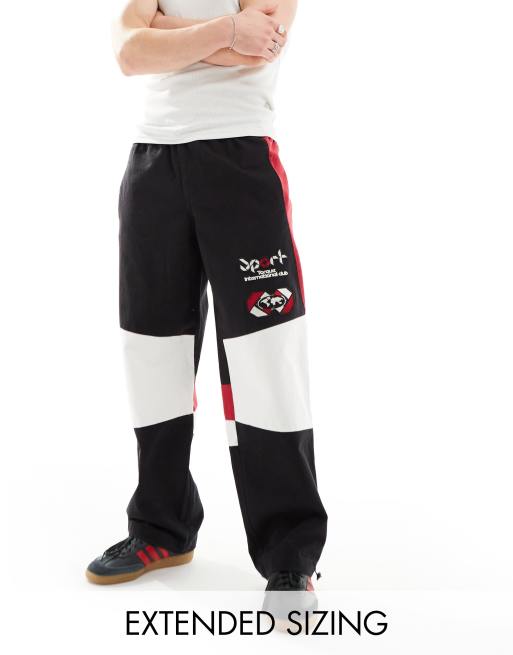 ASOS DESIGN wide leg motocross style trackie pants in black (part of a set)