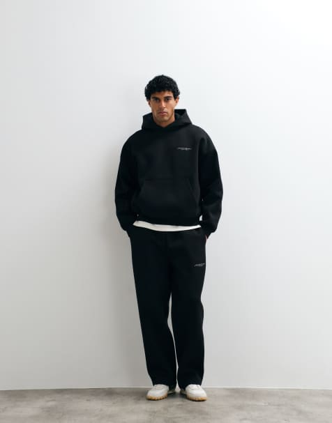 ASOS DESIGN wide leg scuba-style fabric jogger with embroidery in black - view 1